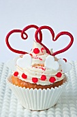 A cupcake decorated with hearts for Valentine's Day