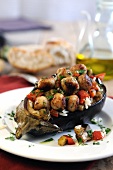 Baked aubergines stuffed with rice, roasted sweet peppers and mini lamb meatballs