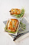 Puff pastry pockets filled with wild asparagus, mozzarella and ham