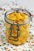 Peach compote in a preserving jar
