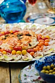Chicory boats and cocktail tomatoes with mediterranean dip