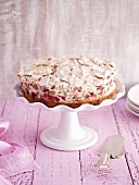 Rhubarb and meringue cake on a cake stand