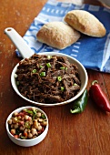 Bowl of Shredded Barbecue Buffalo Meat; Bowl of Chickpea Salad; Crusty Bread