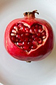 A pomegranate with a heart-shaped cut-out