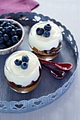 Layered dessert made with gingerbread, blueberries, mascarpone and cream cheese