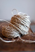 Balls on string on a wooden board