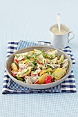 Potato salad with turnips, cucumber, herbs and a cream dressing