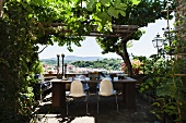 Set table on rustic terrace with view of landscape