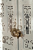 White-painted, Oriental wardrobe (detail)