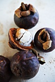 Mangosteens, whole and sliced