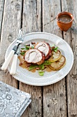 Sliced cochon de lait roulade with apples and beans
