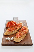 Crostini topped with tomatoes and garlic