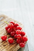 Redcurrants on a wooden surface