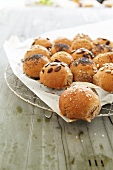 Stuffed bread roll with poppy seeds, salt and seeds