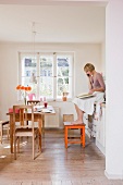 Woman in kitchen talking on a phone