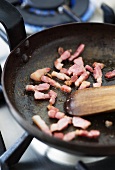 Frying bacon in a pan