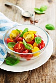 Tomato salad with basil in a glass bowl