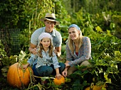 Young family with some pumpkins