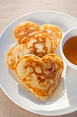 Heart-shaped flapjacks with syrup