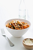 Spaghetti with pumpkin, spinach, pine nuts and feta cheese