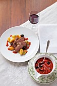 Beef steak with tomato and olive sauce and gnocchi