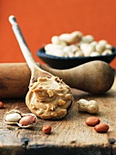 Wooden Spoon of Crunchy Peanut Butter; Peanuts