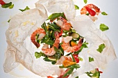 Prawns with vegetables in parchment paper
