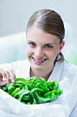 A girl holding lettuce
