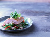 Salmon with panko flour on a bean salad