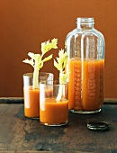 Glasses and a Jar of Carrot Juice; Glasses with Celery Stals