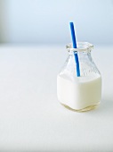 Milk in a Jar with a Blue Straw