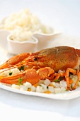 Cray fish on a bed of diced vegetables with a side of rice (Romania)