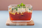 Tomatoes with ajvar and sheep's cheese in a baking dish