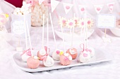 Cake pops with sugar roses and sugar leaves