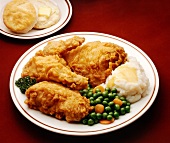 Fried Chicken Dinner Plate; Fried Chicken, Mashed Potato, Peas and Carrots and a Biscuit