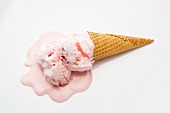 Strawberry Ice Cream Cone Melting on a White Background