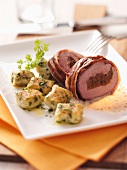 Pork roulade wrapped in bacon with herb gnocchi