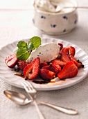 Cream cheese dumpling on strawberries with balsamic vinegar