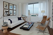 Modern Living Room with a White Sofa and Drapes; City Views