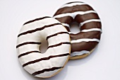 Two black and white doughnuts