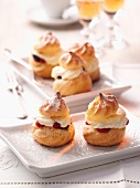 Profiteroles with redcurrants and cream