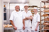 Three bakers in a bakery