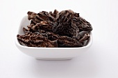 A bowl of dried pointed morel mushrooms