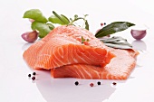 Raw salmon fillet with herbs, garlic and peppercorns