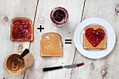 Jars of Peanut Butter and Jelly with Peanut Butter and Jelly on Slices of Bread; Heart Jelly on Peanut Butter Bread
