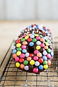 Doughnuts with chocolate glaze and colourful chocolate beans