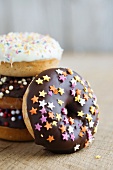 Doughnuts with dark and white chocolate glaze and sugar stars