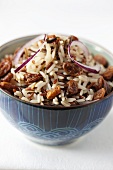 Rice with raisins and red onions in a bowl