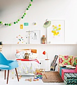 Child's room with a bed, colorful sofa and ball light chain