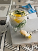 Egg in a glass with cream on spinach - hangover breakfast